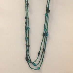 One long strand beaded necklace